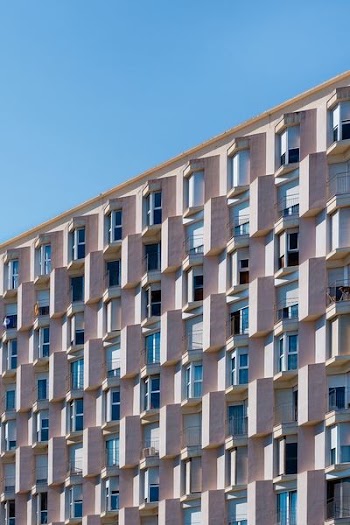 low angle photo of gray concrete building
