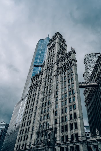 Low Angle Photo of Gray Concrete High Rise Building Next to Trump Hotel in Chicago