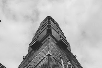 Low Angle Photo of Gray Curtain Wall Building