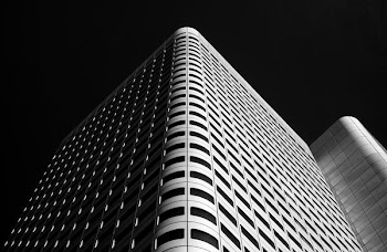 low-angle photo of gray high-rise building