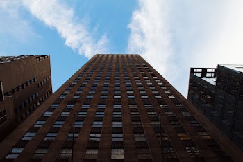 Low Angle Photo of High Rise Building Under Blue Sky