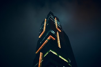 Low-angle Photo of Lighted High-rise Building during Nighttime