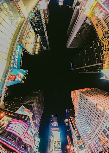 Low-Angle Photo of Lighted High-rise Buildings