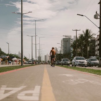 Low Angle Photo of Man Riding Bicycle