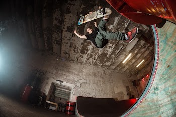 Low Angle Photo of Man Riding Skateboard