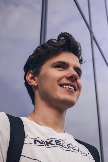 Low Angle Photo of Man Smiling