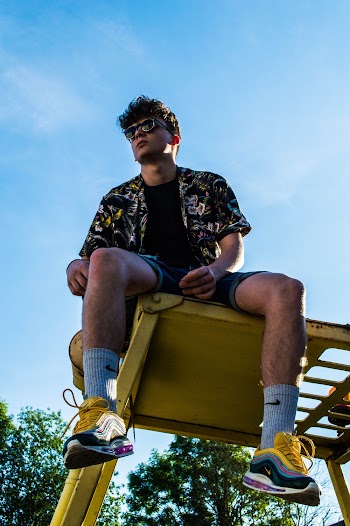Low Angle Photo of Man Wearing Sunglasses