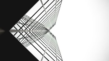 low angle photo of mirror glass building
