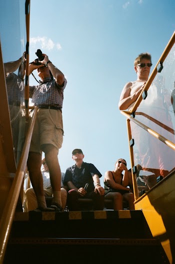 Low-Angle Photo of People Sitting Near the Staircase