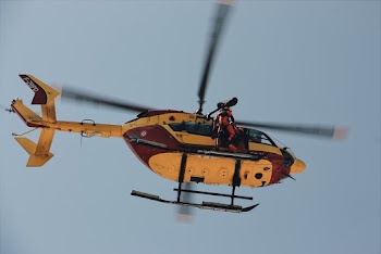 Low Angle Photo of Person on Helicopter