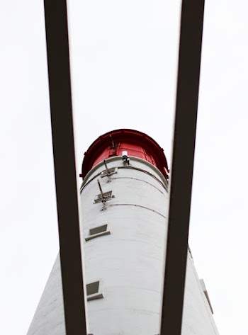 Low-angle Photo of Red and White Lighthouse