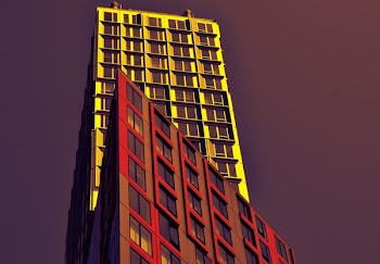 low angle photo of red and yellow high-rise buildings