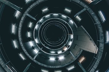 Low Angle Photo of Spiral Ladder