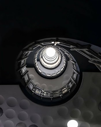 Low Angle Photo Of Spiral Stairs