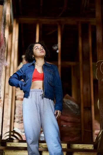 Low-angle Photo of Standing Woman Looking Up