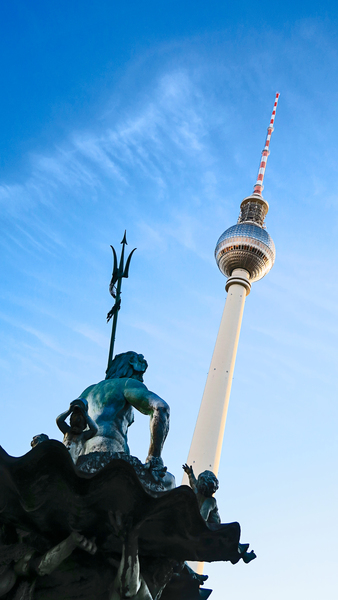 Low Angle Photo of Statue and Tower Structure