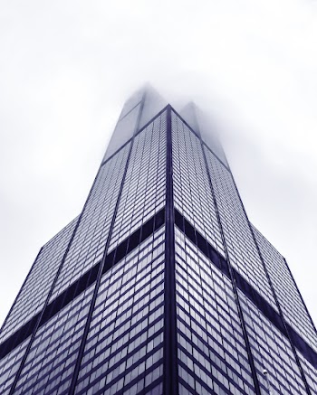 Low Angle Photo of The Willis Tower Covered With Fog