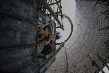 Low Angle Photo of Topless Man on Concrete Platform