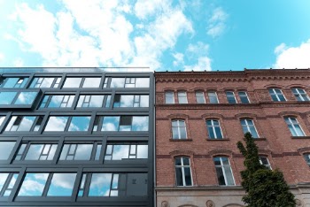 Low Angle Photo of Two Adjacent Apartment Buildings