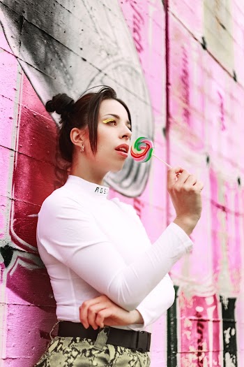 Low Angle Photo Of Woman Leaning On Wall