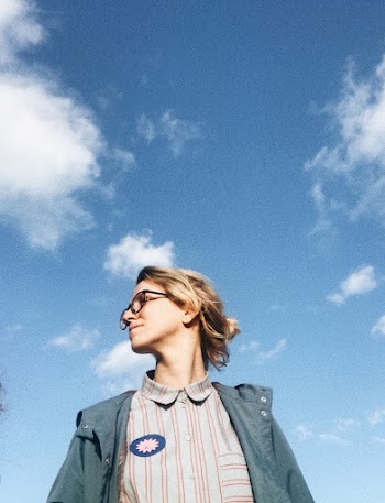 Low Angle Photo of Woman Looking to Her Right