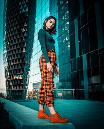 Low-Angle Photo of Woman Standing on Pavement