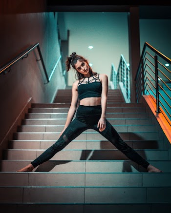 Low-Angle Photo of Woman Standing on Stairs