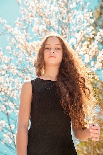 Low Angle Photo of Woman Under Tree