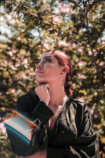 Low Angle Photo of Woman Wearing Black Top
