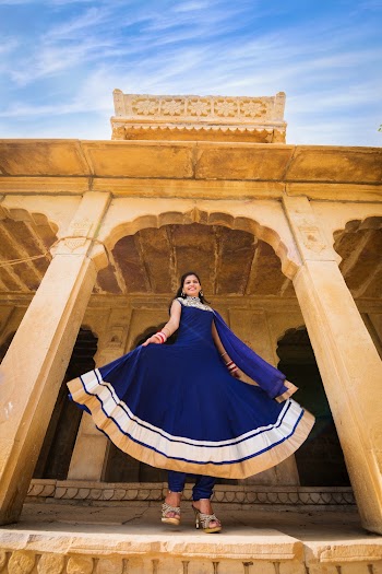 Low-Angle Photo of Woman Wearing Blue Dress