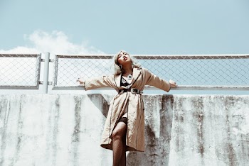 Low Angle Photo of Woman Wearing Brown Coat
