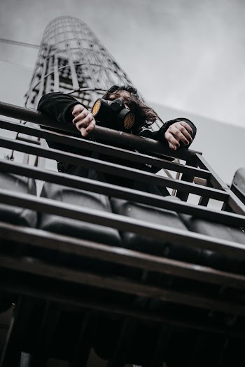 Low Angle Photo Of Woman Wearing Respirator
