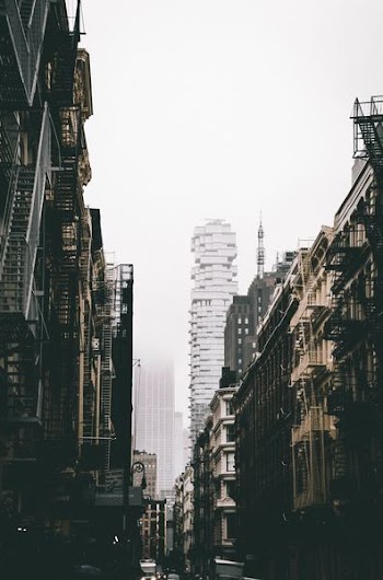 low-angle photography grey and black high-rise buildings