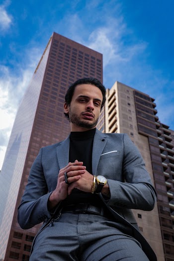 Low Angle Photography of a Man Near Buildings