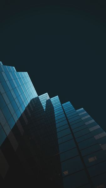 low angle photography of blue building