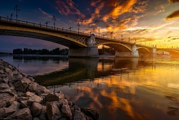 Low-angle Photography of Bridge on Body of Water during Golden Hour Photo