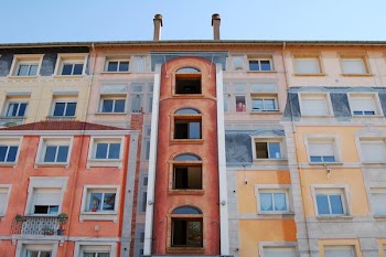 low-angle photography of brown and beige building