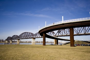 Low Angle Photography of Brown and Gray Bridge Under Blue Calm Sky