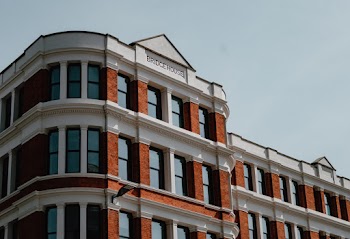 Low Angle Photography of Brown and White Concrete Building