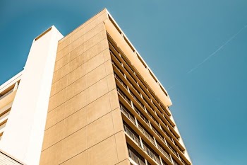 low angle photography of brown concrete building