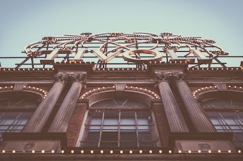 low angle photography of brown concrete building at daytime