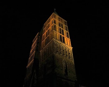 Low-angle Photography of Brown Concrete Building at Night