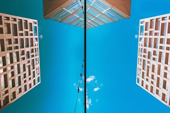 low-angle photography of brown concrete building during daytime
