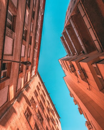 Low Angle Photography of Brown Concrete Buildings