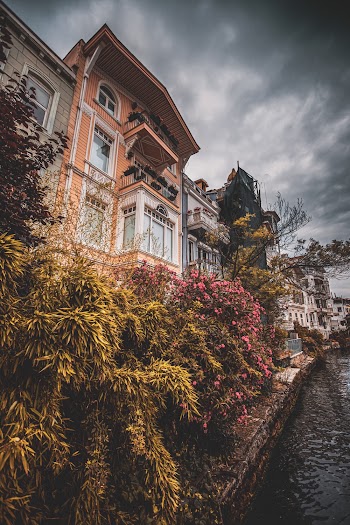 Low Angle Photography of Brown Concrete House On The Waterfront