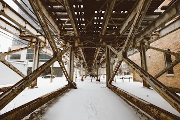 Low Angle Photography of Brown Metal Rails