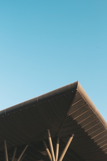 Low Angle Photography of Brown Roof Under Blue Sky