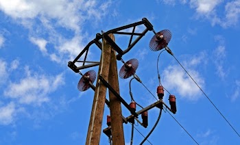 Low Angle Photography of Brown Utility Post