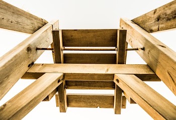 Low-angle Photography of Brown Wooden Stand