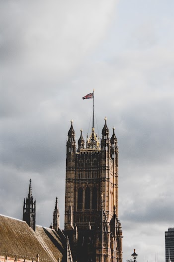 Low Angle Photography of Castle With Uk Flag